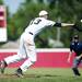 Saline pitcher Michael Hendrickson dives for a hit ball in the game against Bedford on Monday, June 3. Daniel Brenner I AnnArbor.com